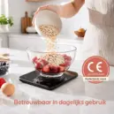 Oats poured into fruit bowl.