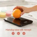 Keukenweegschaal met sinaasappel
